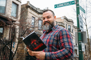 David Jay Collins with Summerdale LGBTQ horror novel in Andersonville